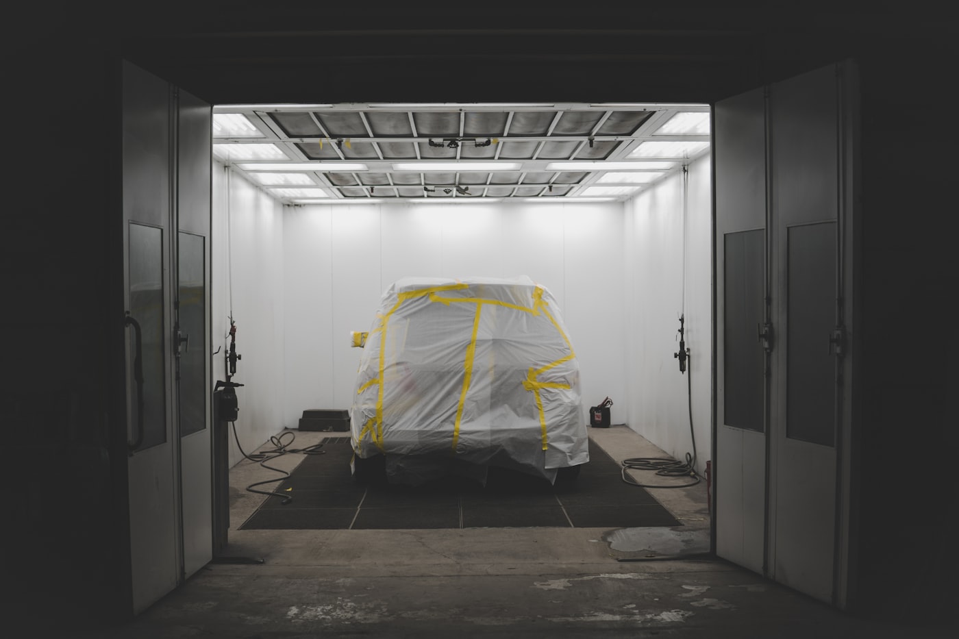 A prepared vehicle inside a professional spray booth